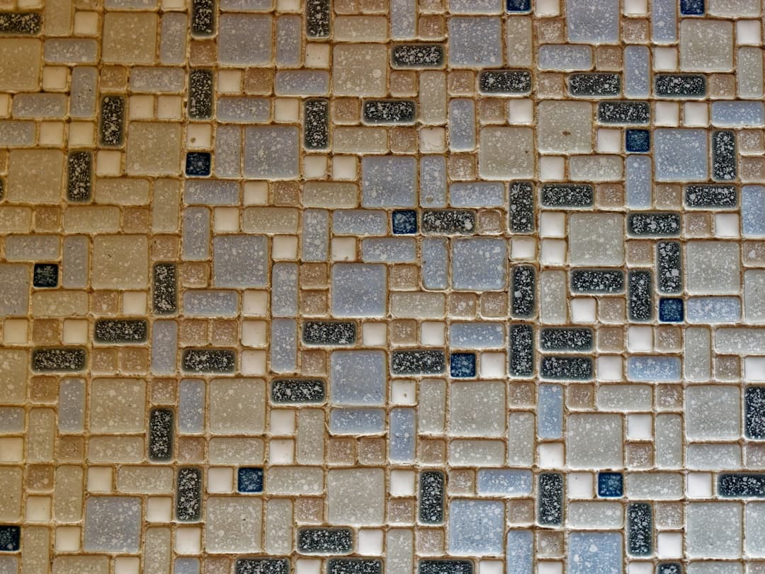 a close up of a wall made of small tiles — Photo by Sabine Freiberger on Unsplash