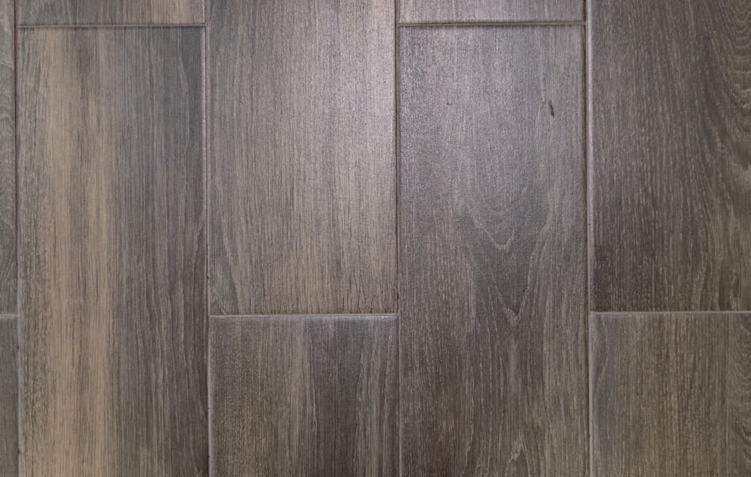 brown and black wooden surface — Photo by Andrea Quiroz on Unsplash